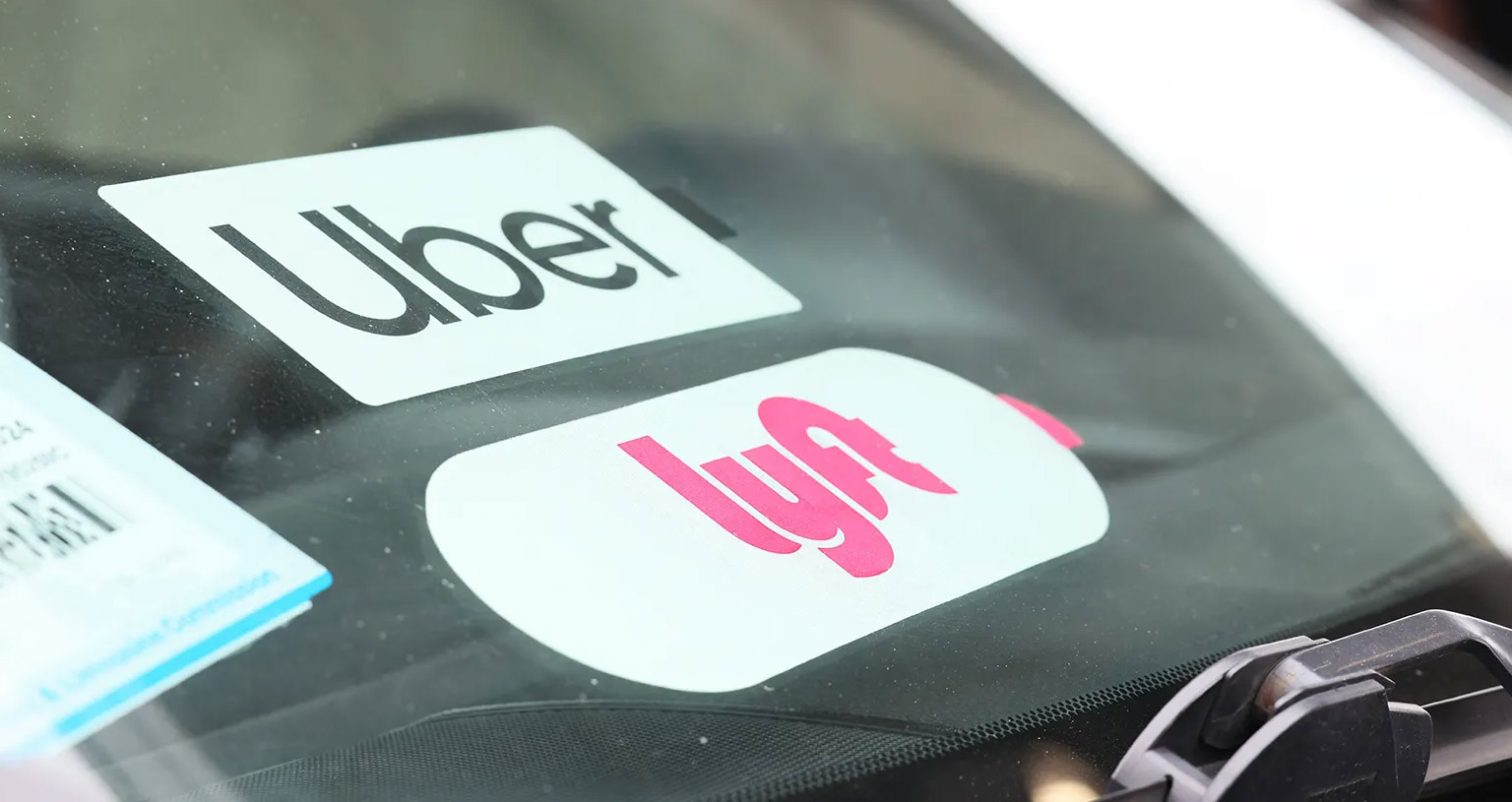 Rideshare car interior with worried passenger in the back seat